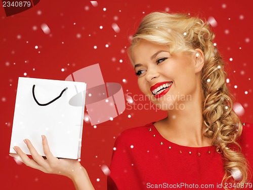 Image of lovely woman in red dress with shopping bag