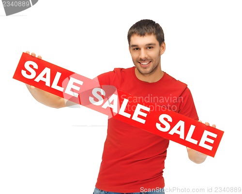 Image of handsome man with sale sign