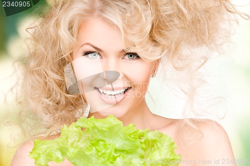 Image of happy woman with lettuce