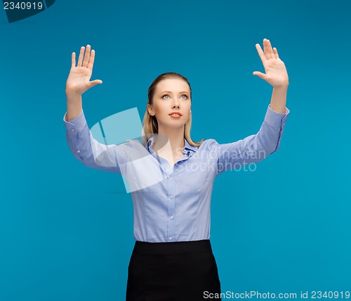 Image of woman working with something imaginary