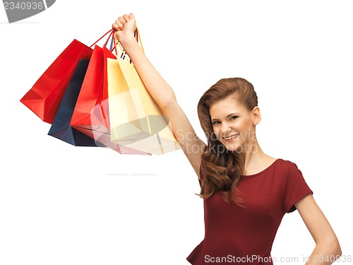 Image of happy teenage girl with shopping bags