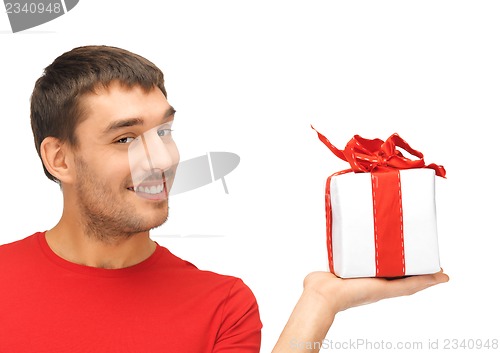 Image of handsome man with a gift