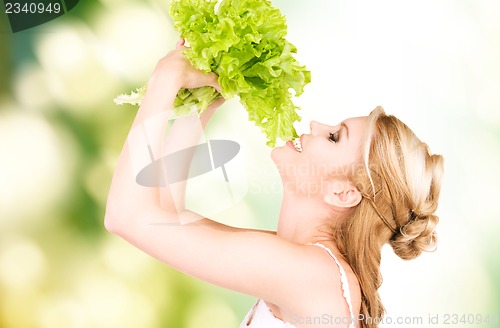 Image of happy woman with lettuce