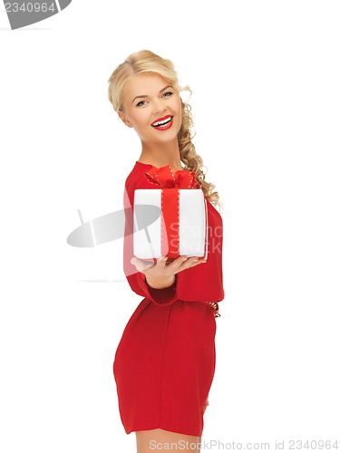 Image of lovely woman in red dress with present