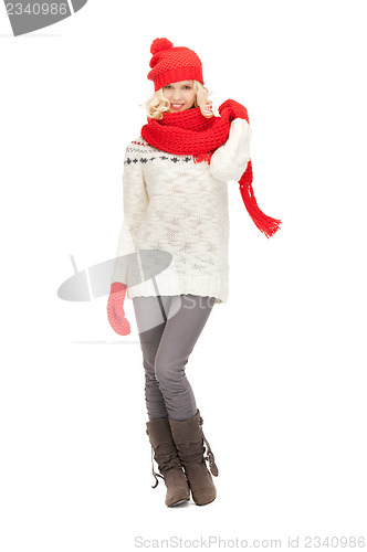 Image of beautiful woman in hat, muffler and mittens