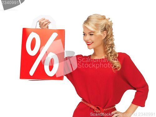 Image of beautiful woman in red dress with shopping bag