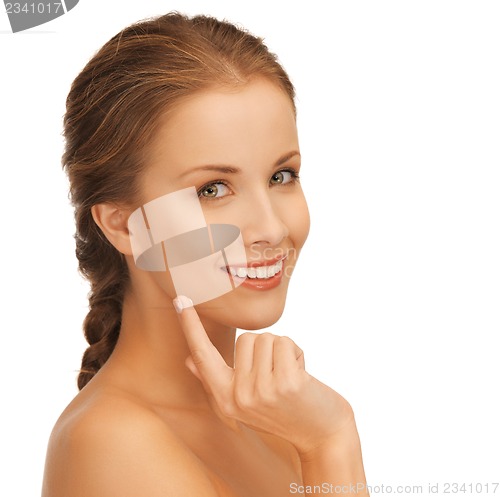 Image of beautiful woman with moisturizing creme drop
