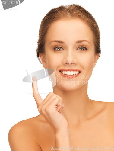 Image of beautiful woman with moisturizing creme drop