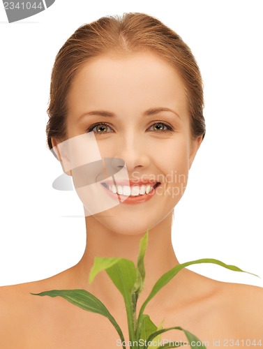 Image of woman with green sprout