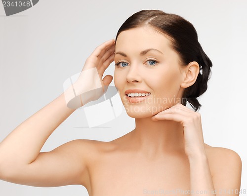 Image of face and hands of beautiful woman