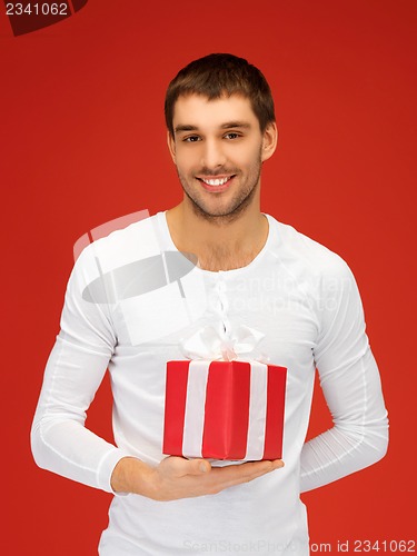 Image of handsome man with a gift