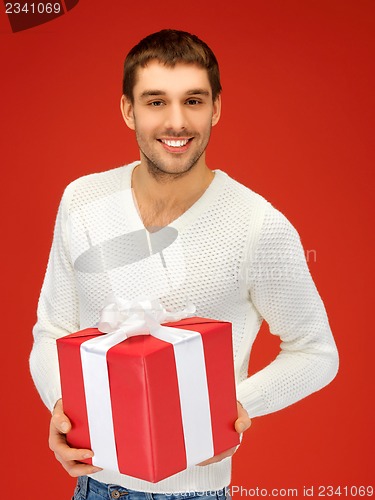 Image of handsome man with a gift