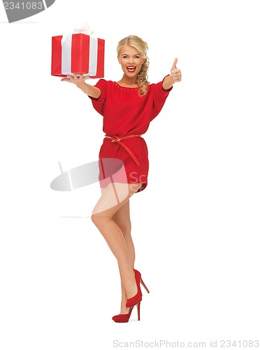 Image of woman in red dress with gift box