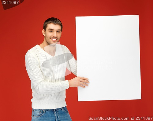 Image of handsome man with big blank board