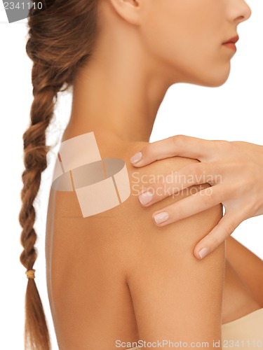 Image of woman's hand and shoulder
