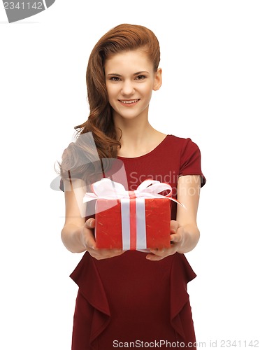 Image of teenage girl in red dress with gift box
