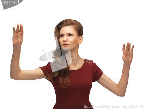 Image of teenage girl working with something imaginary