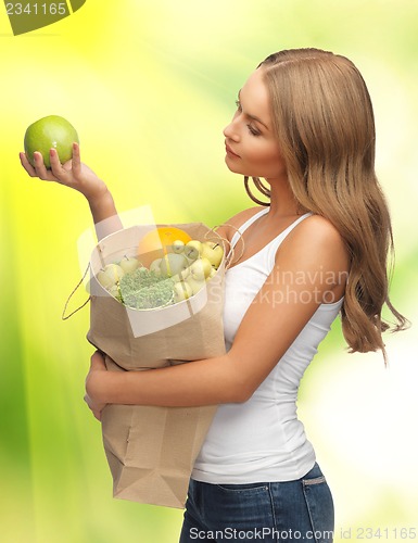 Image of woman with shopping bag full of fruits