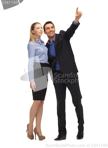 Image of man and woman pointing their fingers