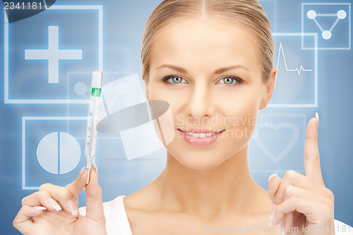 Image of attractive female doctor with thermometer