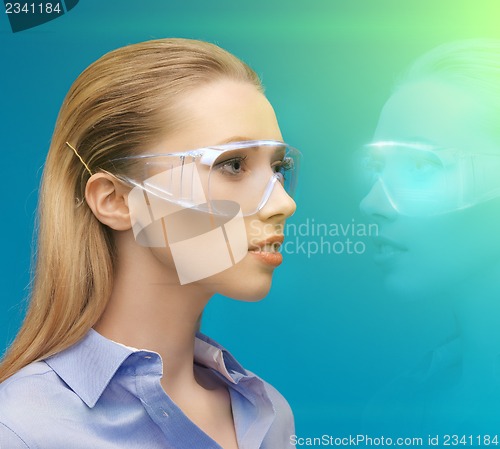 Image of woman in 3d glasses with hologram