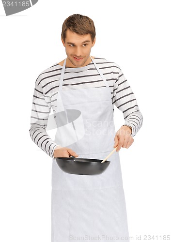 Image of handsome man with pan and spoon