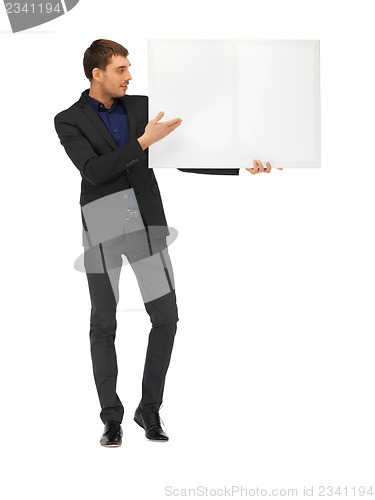 Image of handsome man in suit with a blank board