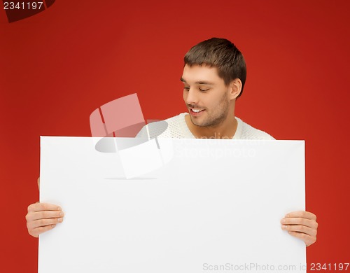 Image of handsome man with big blank board