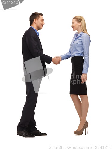 Image of man and woman shaking their hands