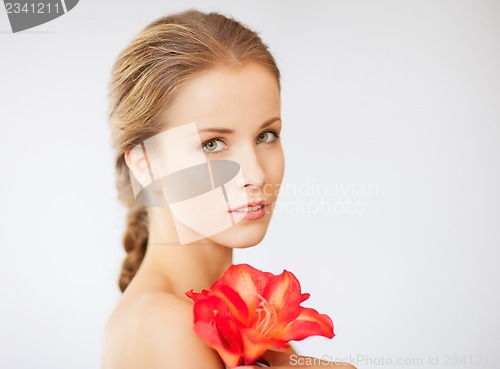 Image of lovely woman with lily flower