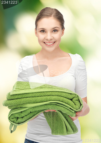 Image of lovely housewife with towels