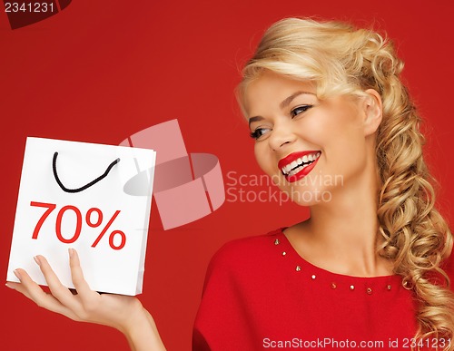 Image of lovely woman in red dress with shopping bag