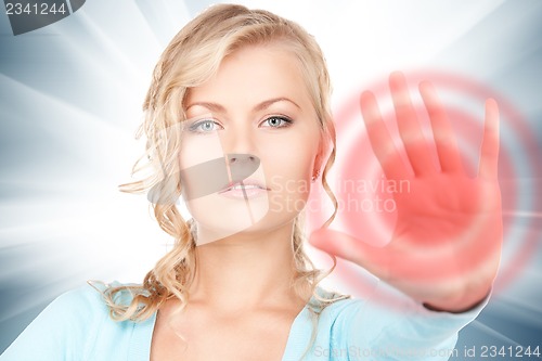 Image of woman making stop gesture