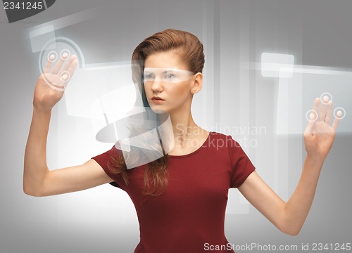 Image of teenage girl working with virtual screen