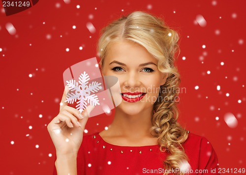Image of lovely woman in red dress with snowflake