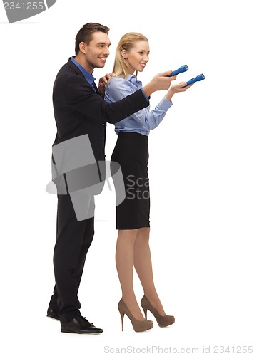 Image of man and woman with flashlights