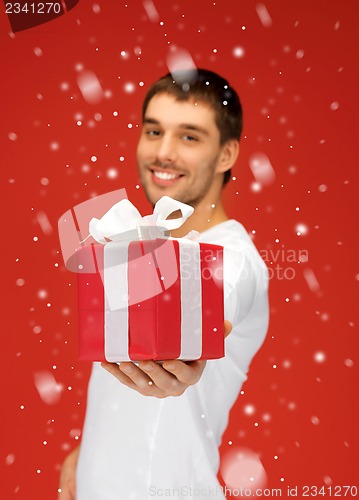 Image of handsome man with a gift