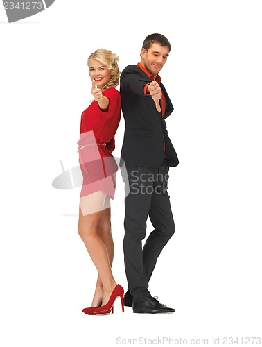 Image of man and woman showing thumbs up, down