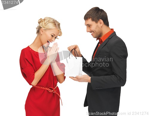 Image of man and woman with present