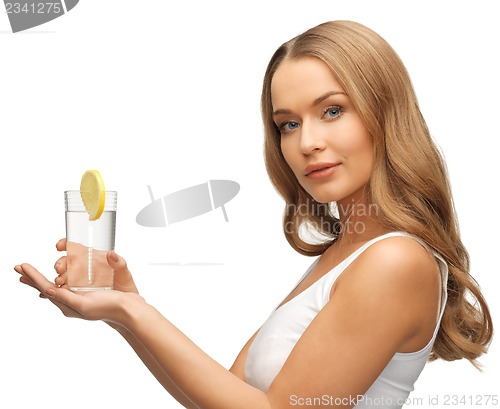 Image of woman with lemon slice on glass of water