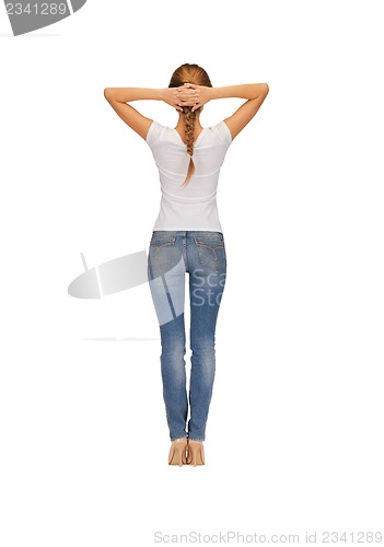 Image of rear view of woman in blank white t-shirt