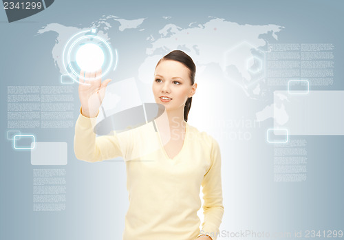 Image of businesswoman working with touch screen