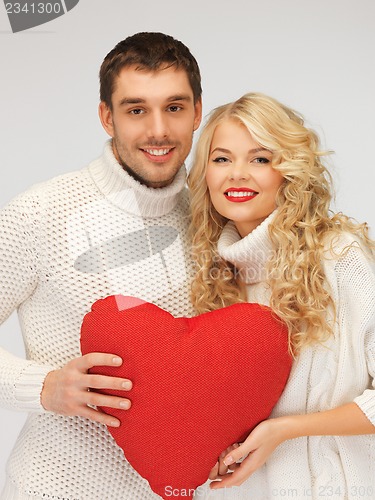 Image of family couple in a sweaters with heart