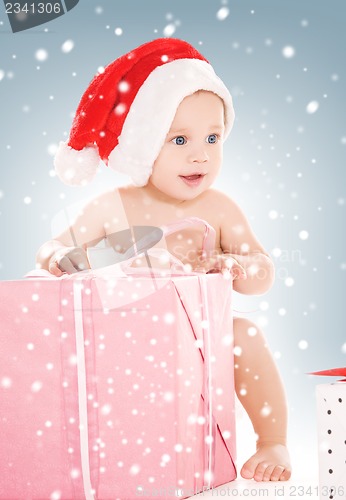 Image of santa helper baby with christmas gifts
