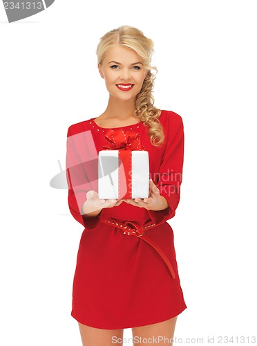 Image of lovely woman in red dress with present