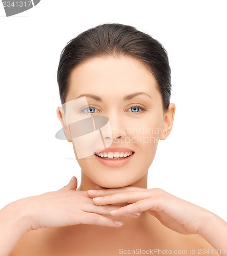 Image of face and hands of beautiful woman