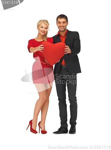 Image of beautiful couple holding big heart