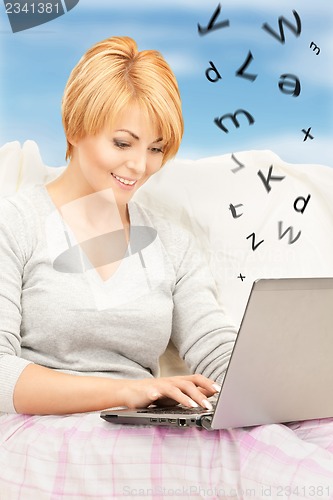 Image of happy woman with laptop computer