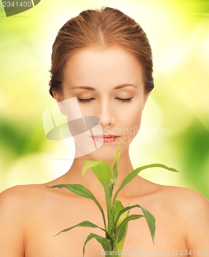 Image of woman with green sprout