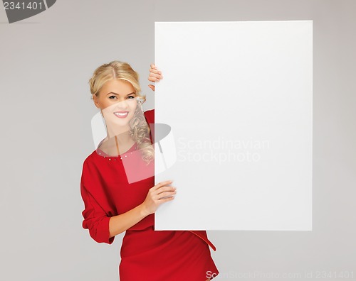 Image of lovely woman in red dress with blank board